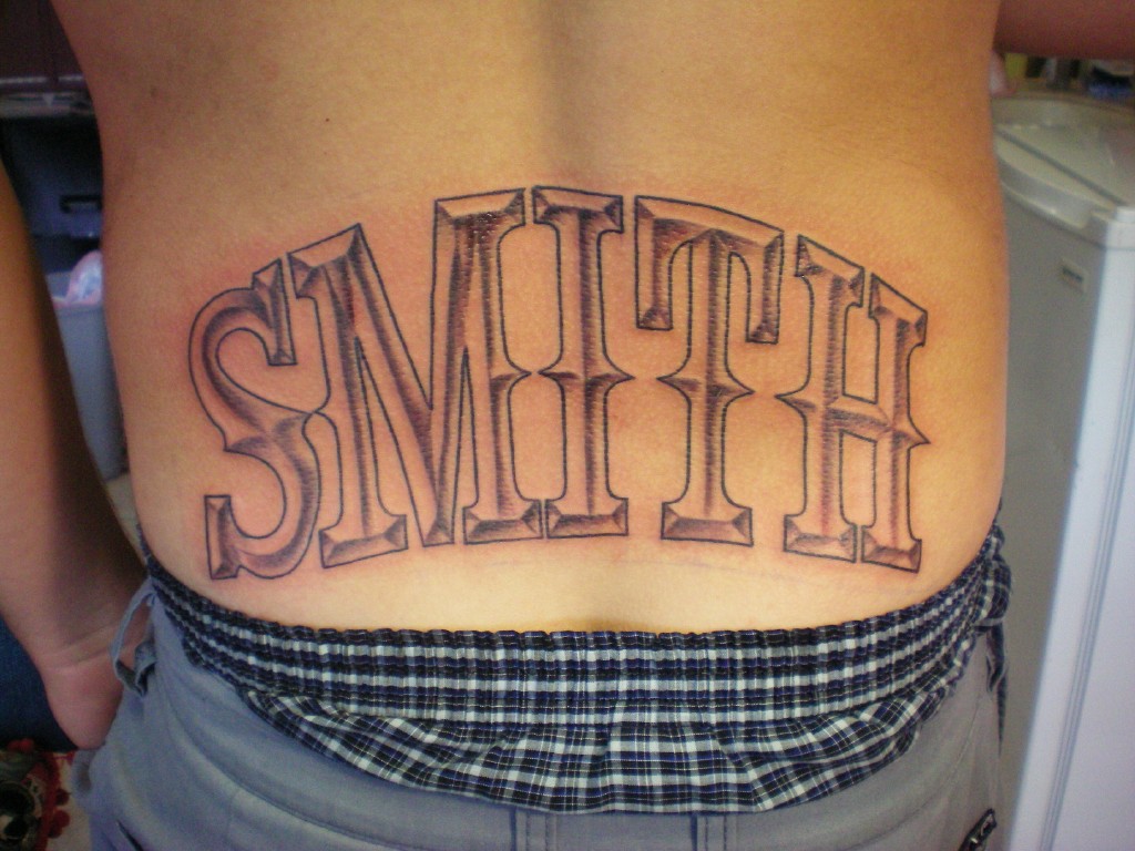 Smith Lettering Tattoo On Lower Back