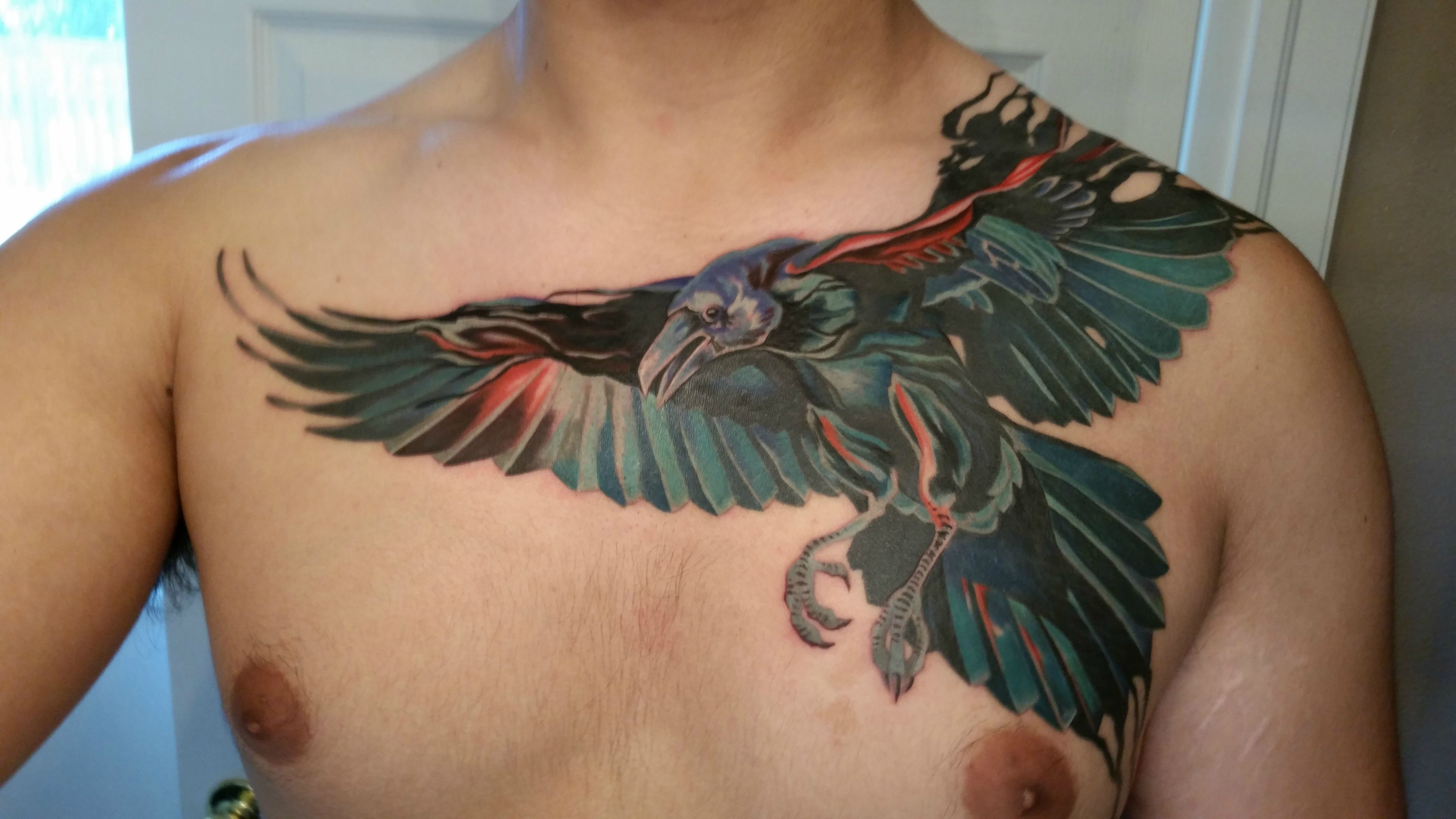 Unique Colorful Flying Raven Tattoo On Man Chest