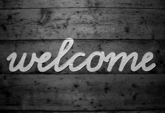 Welcome With Wooden Background