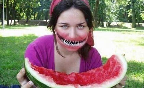 Woman Eating Watermelon With Funny Shark Fish Mouth