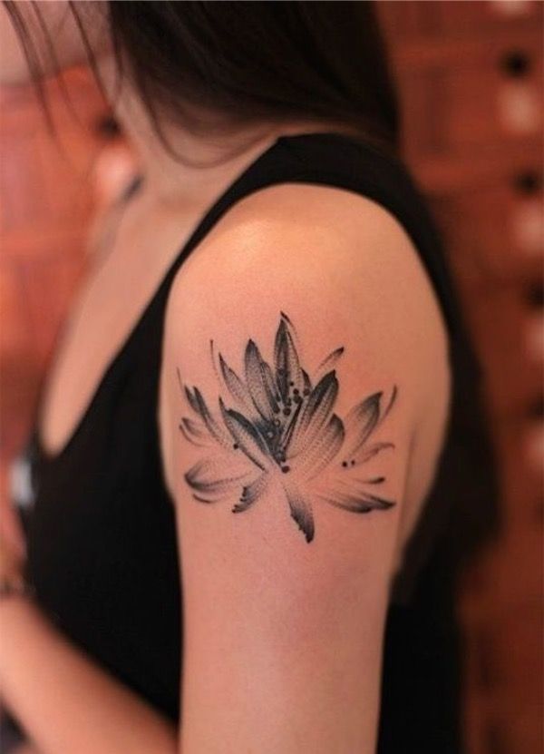 Amazing Black Ink Lotus Tattoo On Girl Left Shoulder By Khandiie