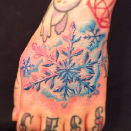 Amazing Colorful Snowflake Tattoo On Hand