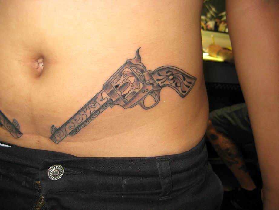 Amazing Gun Tattoo On Hip