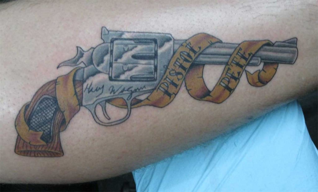 Amazing Gun With Banner Tattoo Design For Forearm