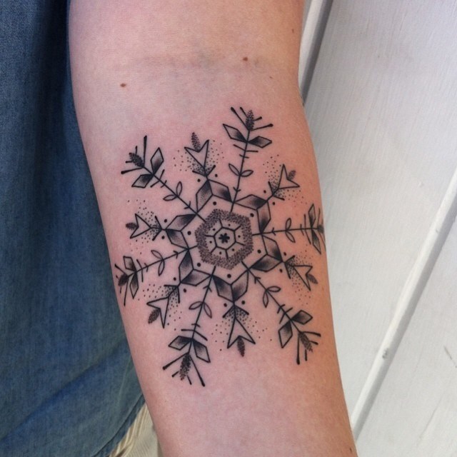 Awesome Black And Grey Snowflake Tattoo Design