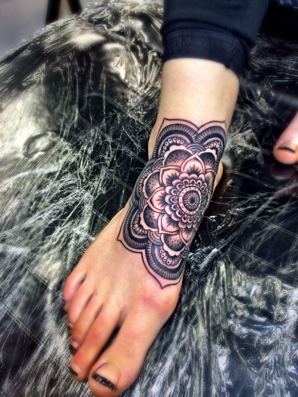 Awesome Black Mandala Flower Tattoo On Girl Foot