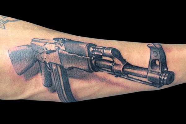 Black And Grey 3D Ak 47 Gun Tattoo Design For Forearm