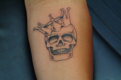 Black And Grey Crown On Skull Tattoo On Arm