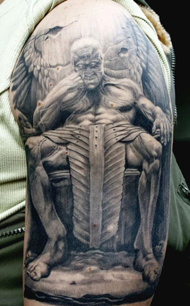 Black And Grey Devil Statue Tattoo On Shoulder By Erich Rabel