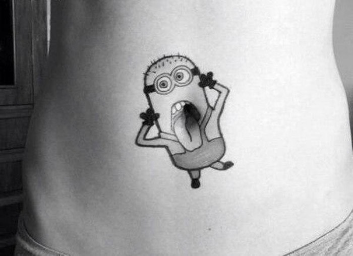 Black And Grey Minion Tattoo On Belly Button