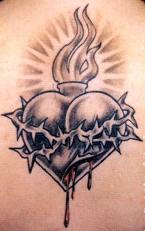 Black And Grey Sacred Heart With Barbed Tattoo Design