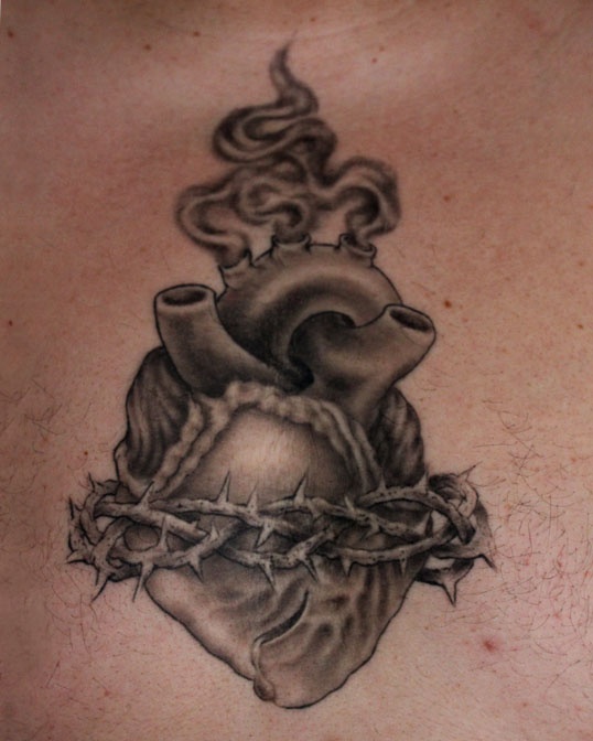 Black And Grey Sacred Real Heart With Barbed Tattoo Design