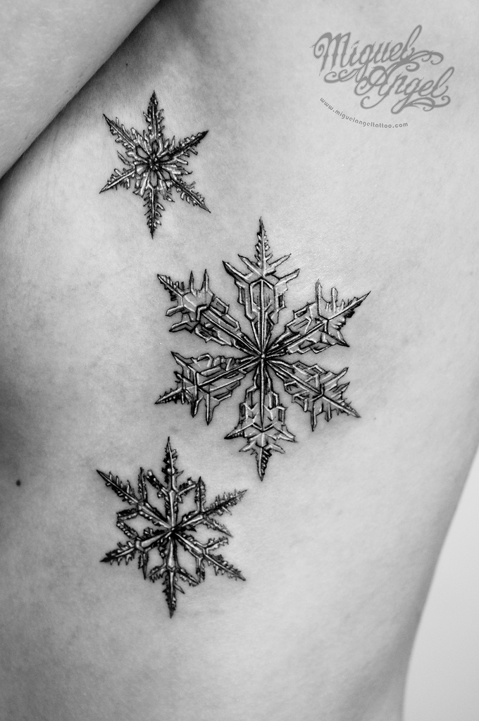 Black And Grey Three Snowflake Tattoo On Side Rib By Miquel Angel