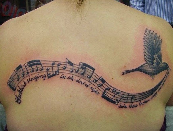 Black Flying Bird With Music Knots Tattoo On Girl Upper Back