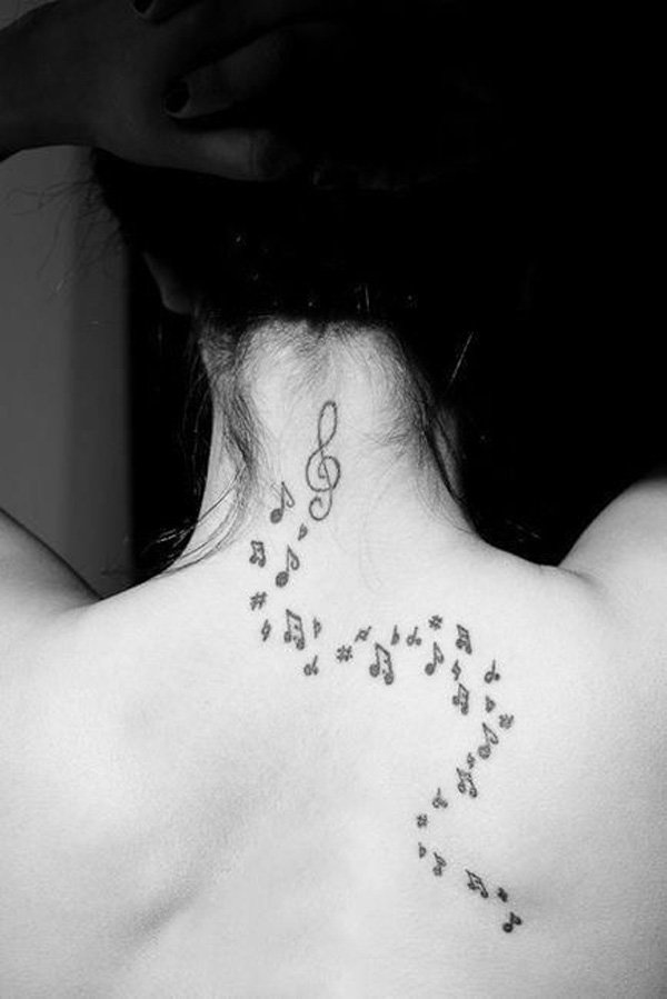Black Flying Music Knots Tattoo On Girl Upper Back