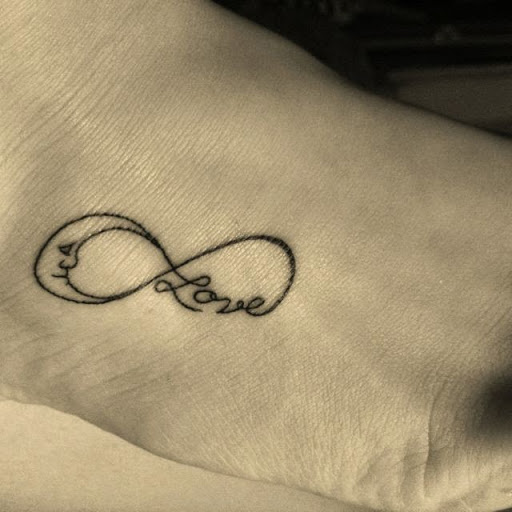 Black Ink Love Infinity Tattoo On Right Foot