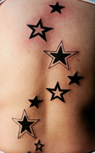 Black Ink Star Tattoos On Back Body