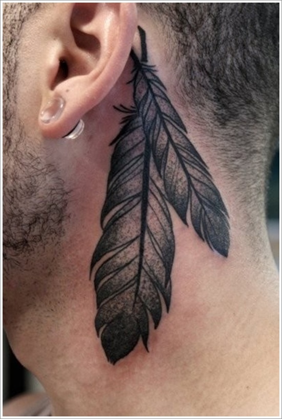 Black Ink Two Feather Tattoo On Man Behind The Ear