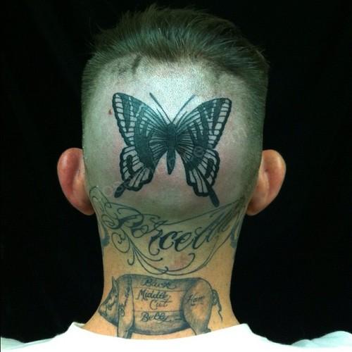Black Traditional Butterfly Tattoo On Man Head