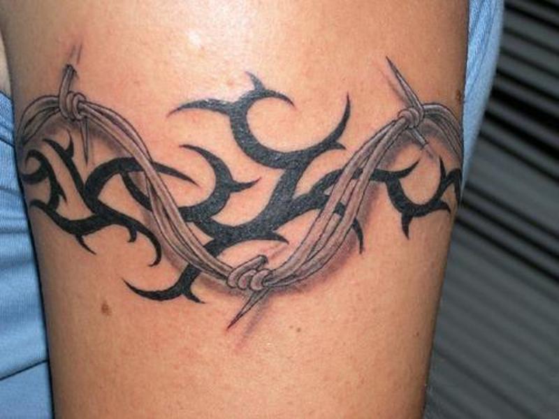 Black Tribal and Barbed Wire Bicep Tattoo
