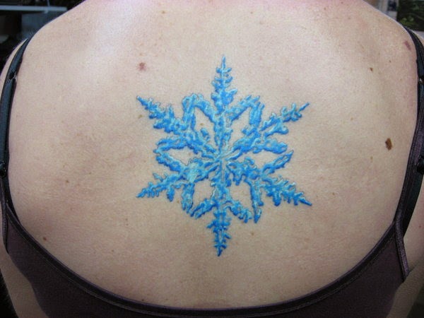 Blue Ink Snowflake Tattoo On Upper Back