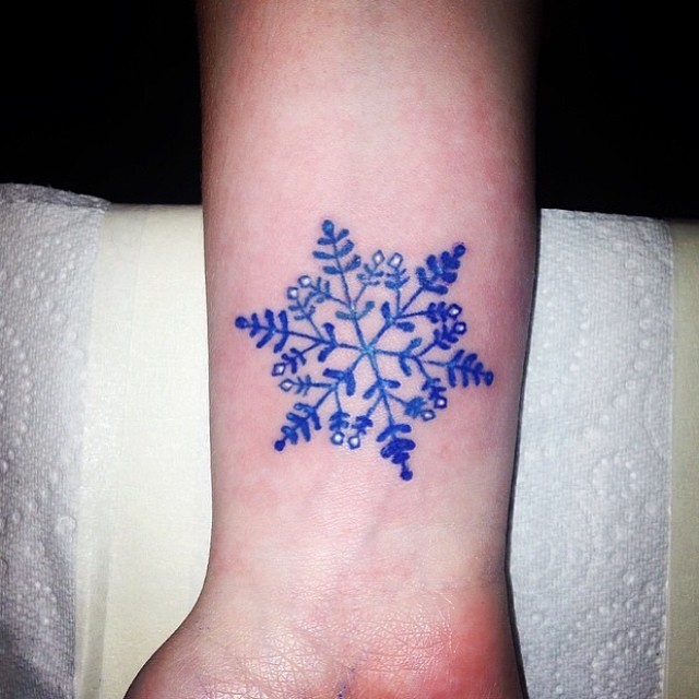 Blue Ink Snowflake Tattoo On Wrist By Dolly