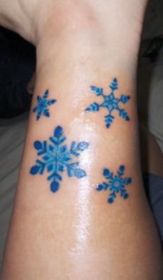Blue Ink Snowflakes Tattoo Design For Leg