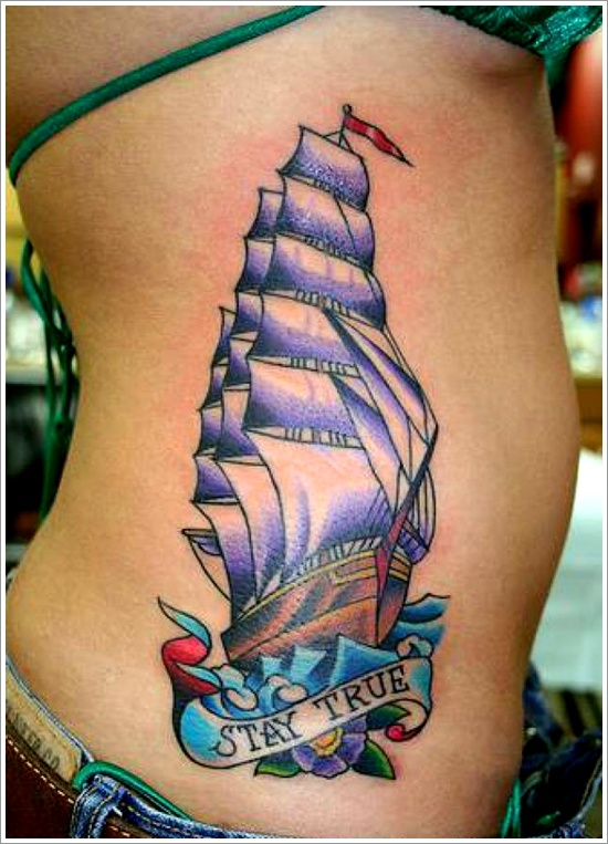 Colorful Ship With Banner Tattoo On Girl Side Rib