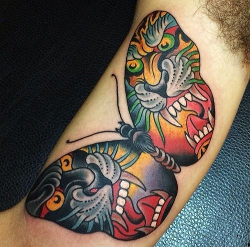 Colorful Traditional Butterfly Tattoo On Bicep