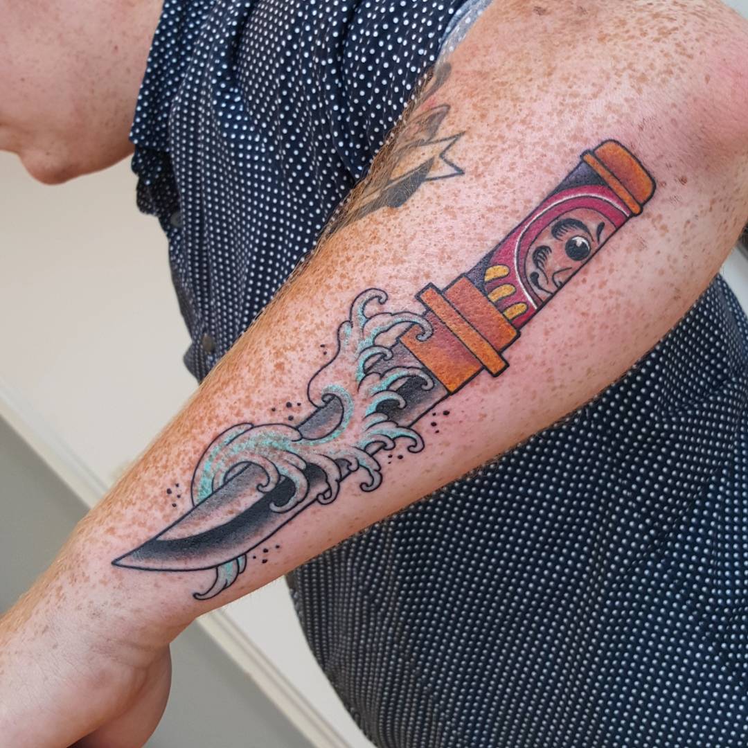 Colorful Traditional Knife Tattoo On Man Forearm