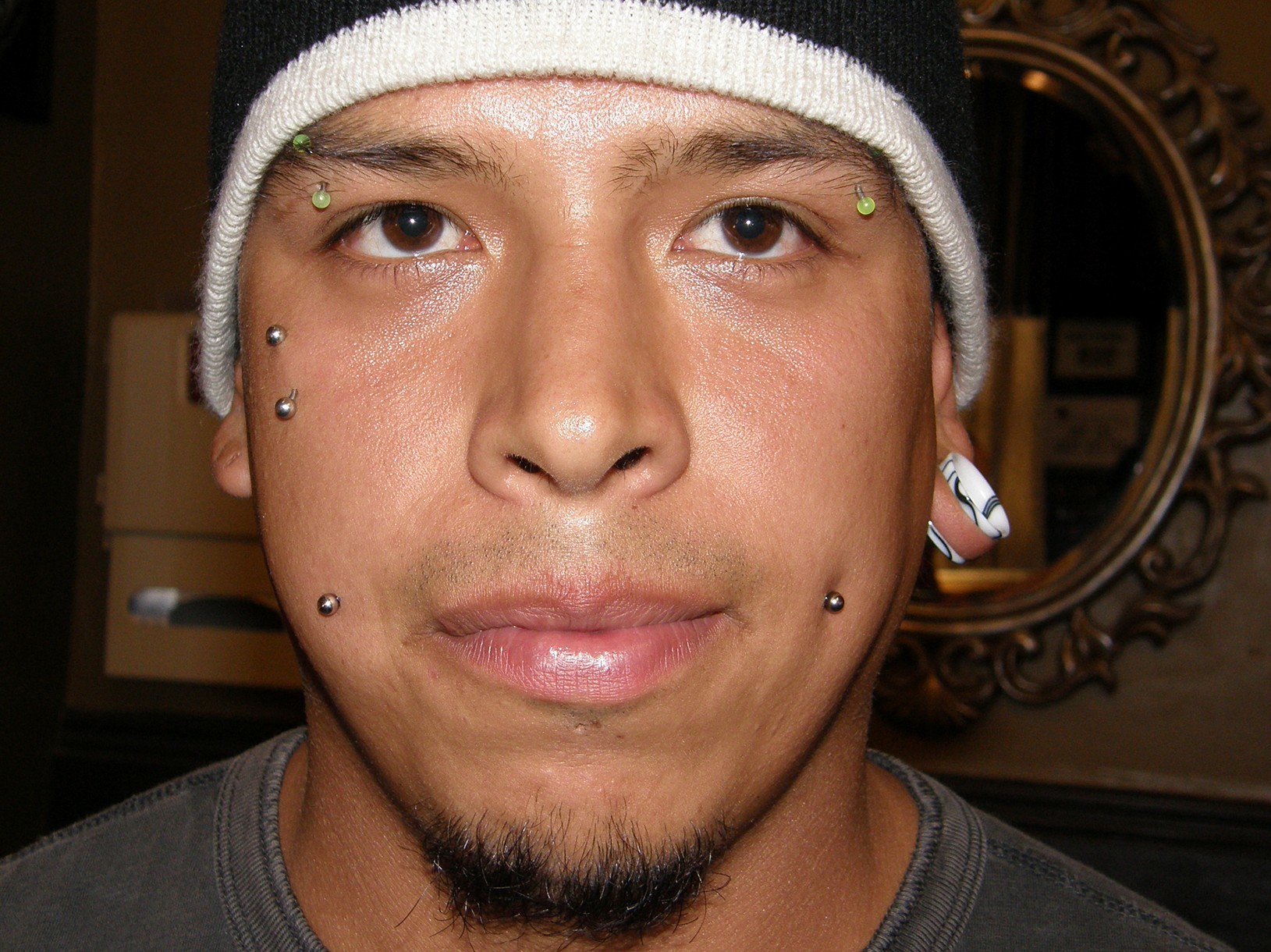 Dimple Cheeks And Teardrop Piercing With Vertical Barbell