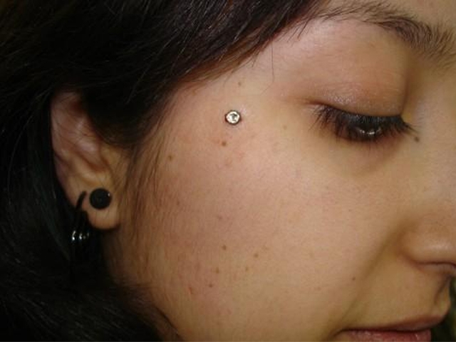 Double Lobe And Teardrop Piercing Picture.