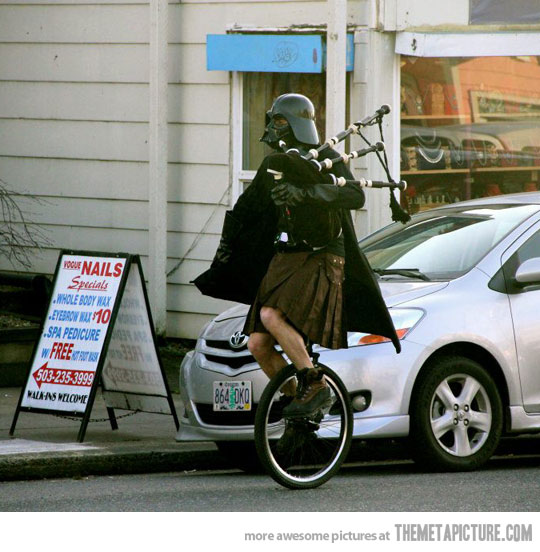Funny Darth Vader In Skirt Riding One Wheel Bicycle