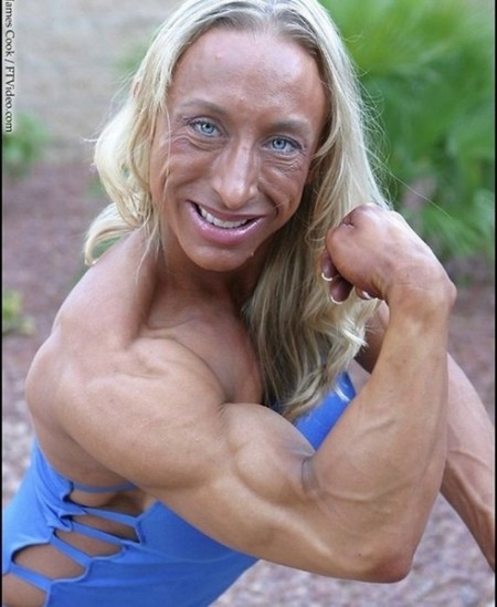 Funny Muscular Woman Show Muscles