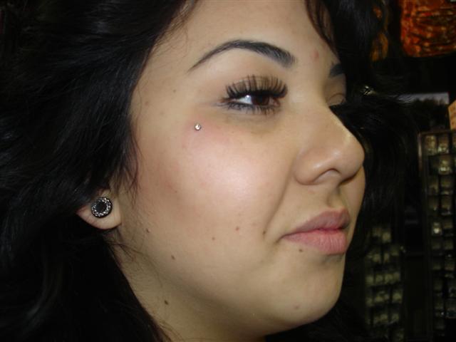 Girl With Right Ear Lobe And Teardrop Piercing Picture