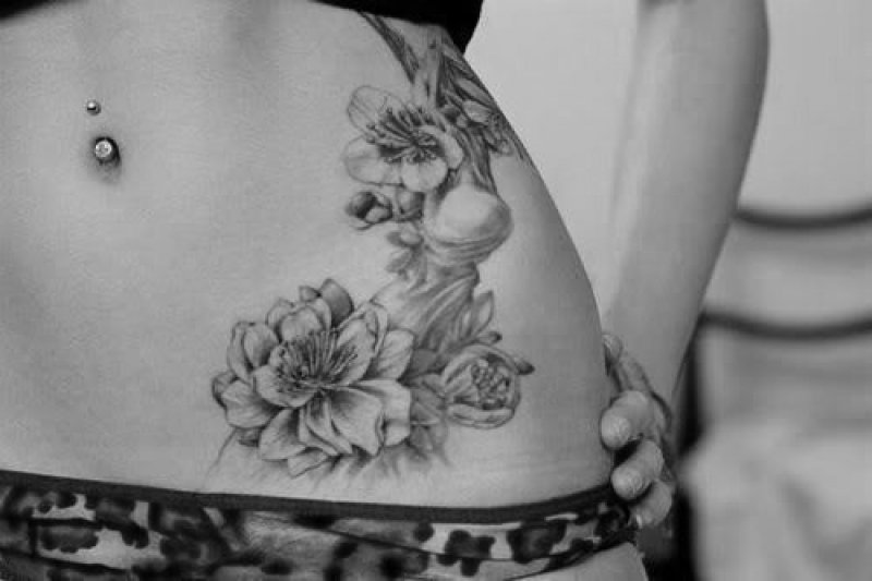 Grey Ink Flowers Tattoo On Girl Hip