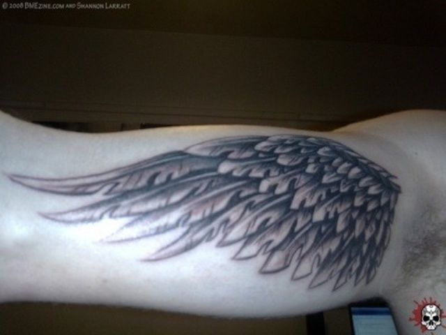 Grey Ink Wings Bicep Tattoo For Men