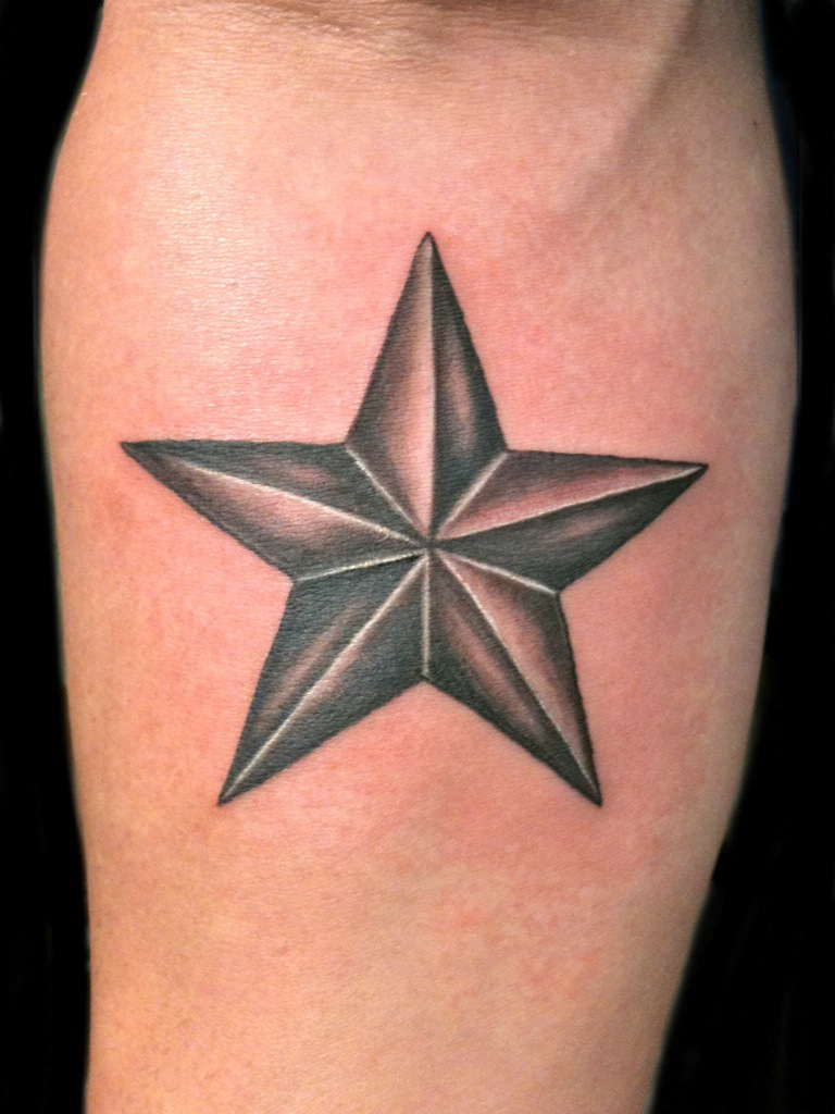 Grey Nautical Star Tattoo On Forearm