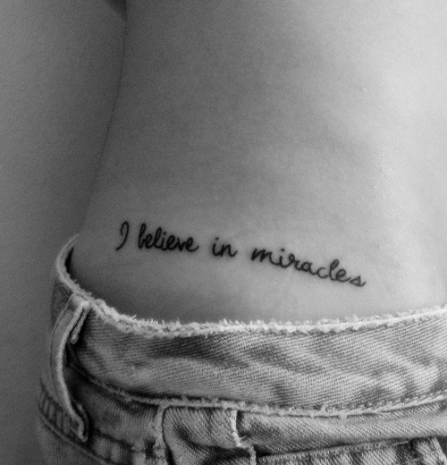 I Believe In Miracles Lettering Tattoo On Side Hip