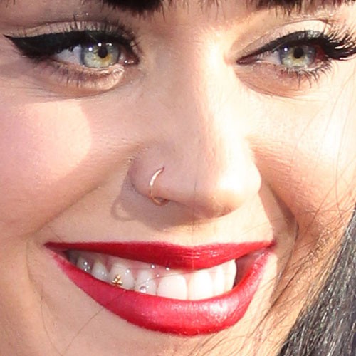 Katy Pery With Tooth Gem Piercing And Nose Piercing Idea