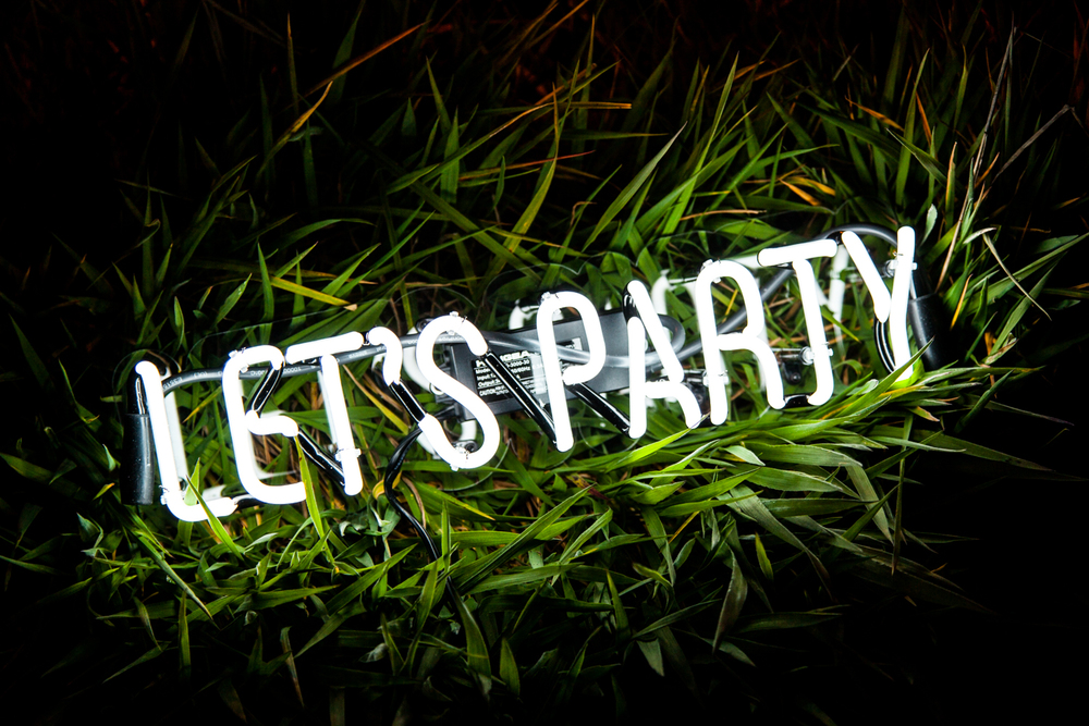 Let's Party Glowing Text On Grass