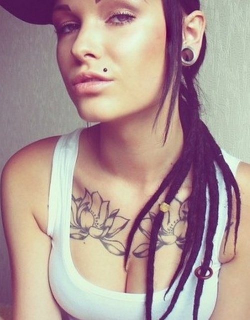 Lotus Flower Tattoos And Black Stud Madonna Piercing