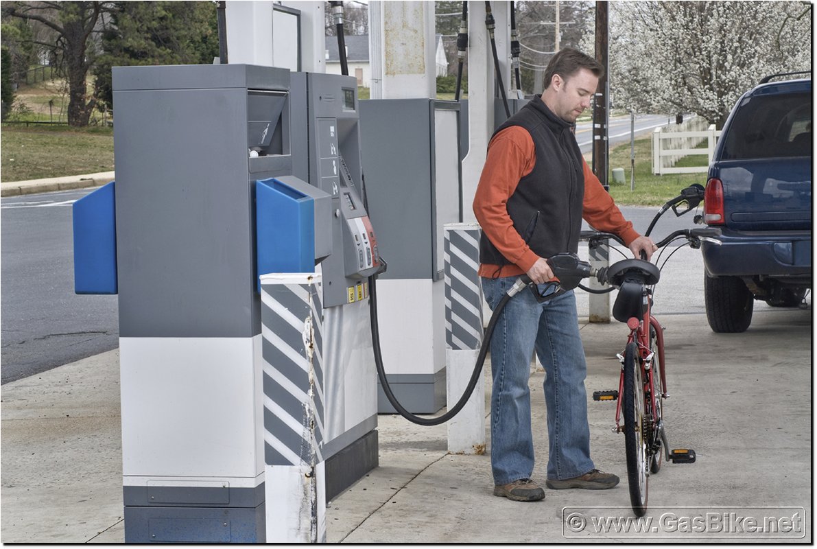 Man Filling Fuel In Bicycle Funny Image