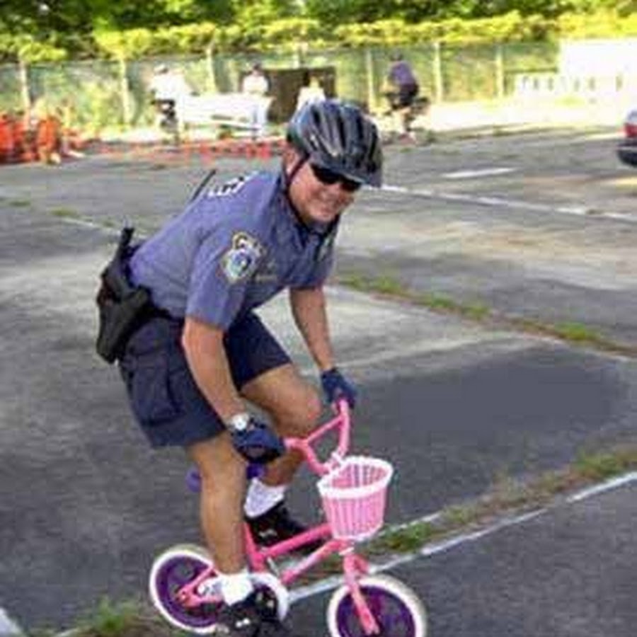 Man Riding Funny Small Pink Bicycle