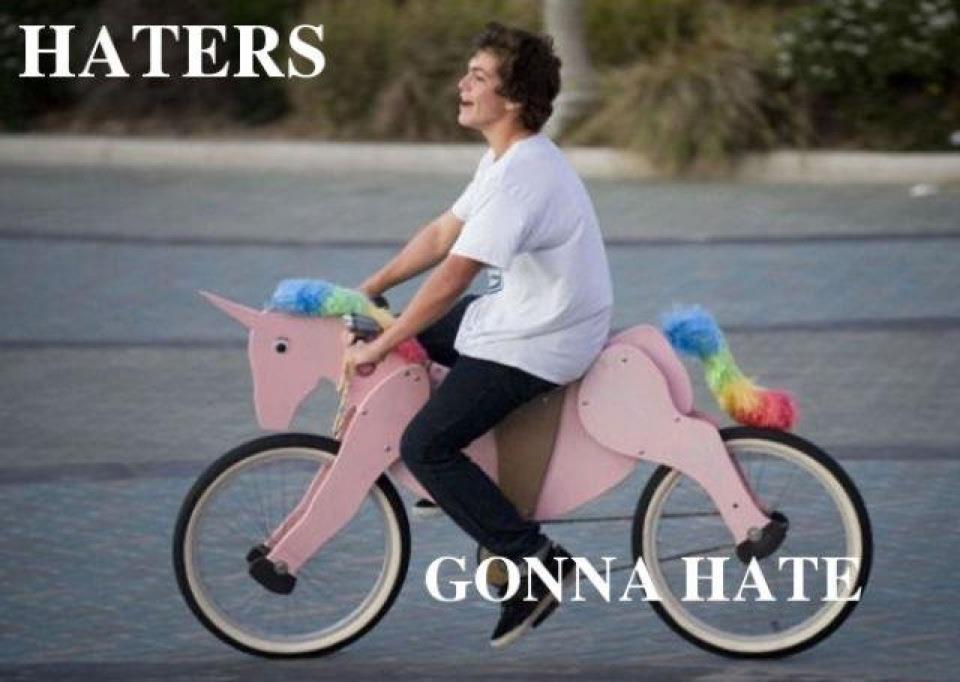 Man Riding Funny Unicorn Pink Bicycle