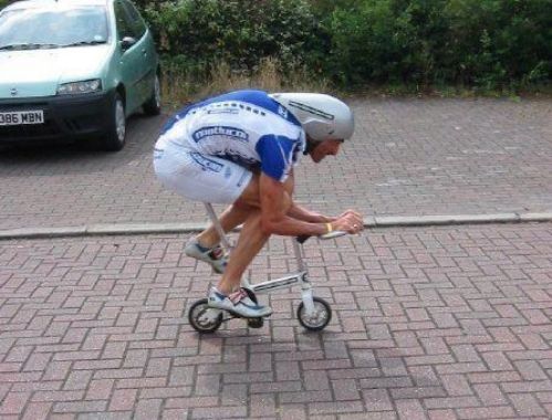 Man Riding Tiny Bicycle Funny Image