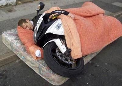 Man Sleeping With Bike Funny Picture