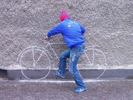 Man Trying To Ride Painted Bicycle Funny Image