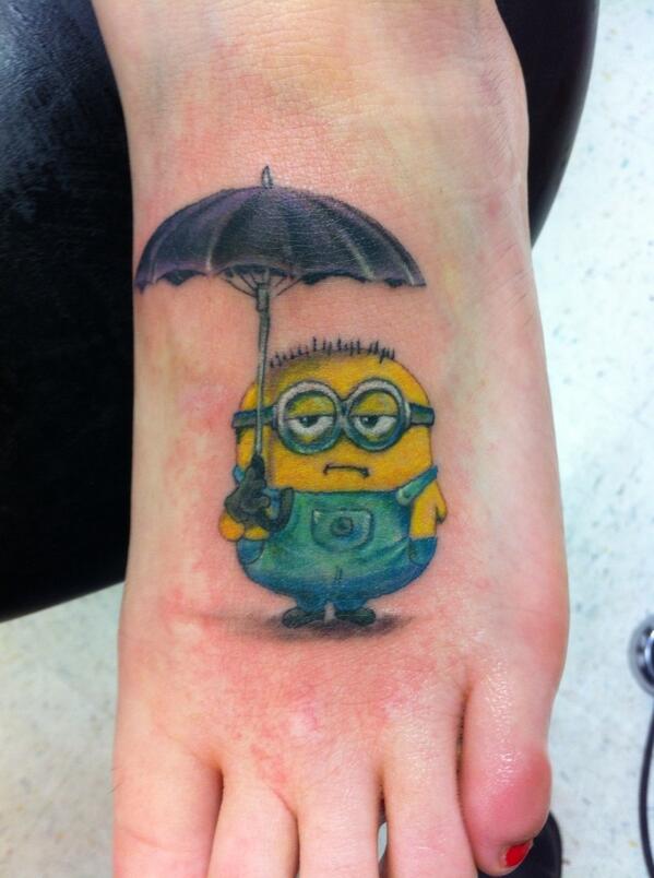 Minion With Umbrella Tattoo On Girl Foot