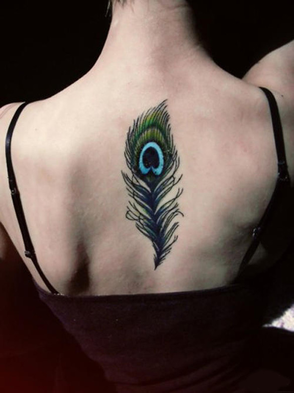 Peacock Feather Tattoo On Girl Upper Back